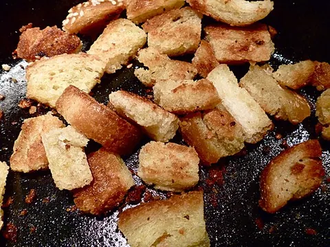 crouton: a small, often seasoned, piece of dry or fried bread