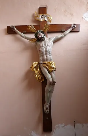 crucifix: a wooden structure used for crucifixions, as by the Romans