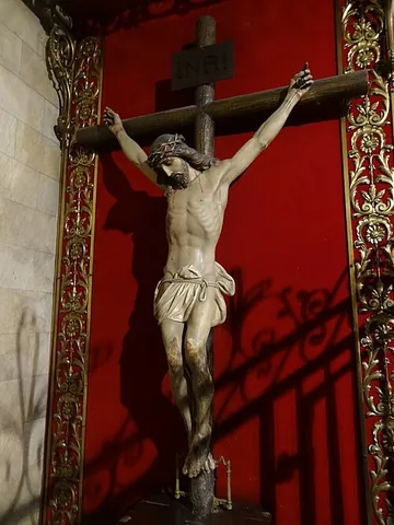 crucifixion: an execution by being nailed or tied to an upright cross and left to hang there until dead