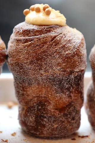 cruffin: a pastry combining characteristics of a croissant and a muffin. A muffin-like breadstuff made from...