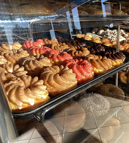 cruller: a donut in the form of a twisted ring