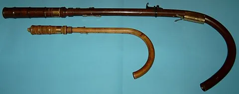 crumhorn: any of several related simple woodwind instruments having a bent horn