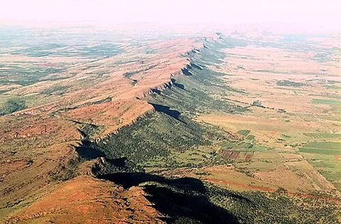 cuesta: a hill or ridge with a gentle slope on one side, and a steep slope on the other