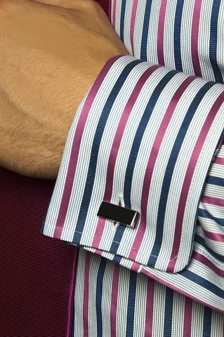 cufflink: a button or stud used to hold a sleeve cuff together