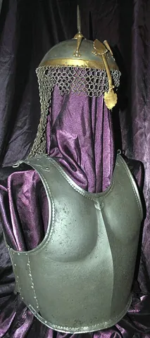 cuirass: a piece of defensive armor, covering the body from the neck to the girdle