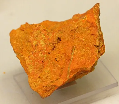 curite: an orthorhombic-dipyramidal mineral containing hydrogen, lead, oxygen, and uranium