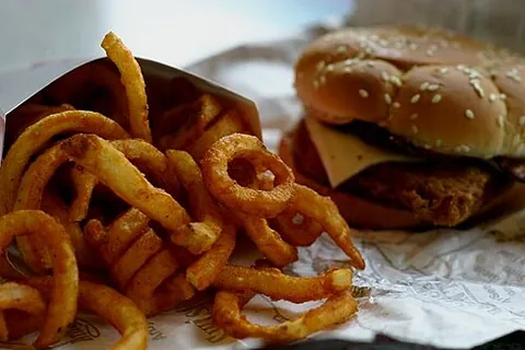 curly fries: a kind of fries characterized by their spring-like helical shape, being cut from whole potatoes...