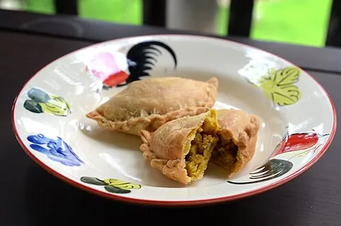 curry puff: a Southeast Asian snack, a small pie consisting of curry with chicken and potatoes in a deep-fried...