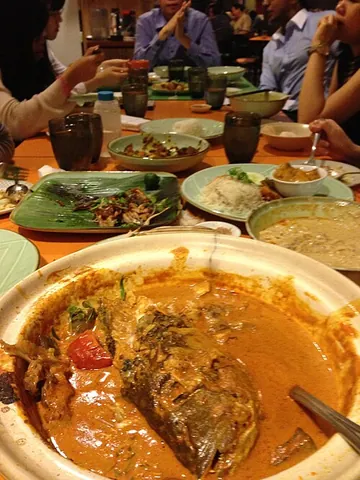 curry: one of a family of dishes originating from Indian cuisine, flavored by a spiced sauce
