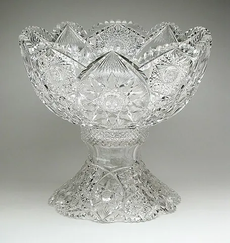 cut glass: glass that has been cut, using an abrasive wheel, into a decorative pattern of facets