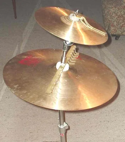 cymbal: a concave plate of metal, usually brass or bronze, that produces a sharp, ringing sound when...