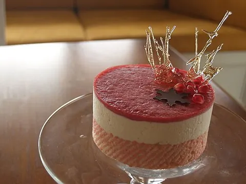 dacquoise: a dessert cake made with layers of almond and hazelnut meringue and whipped cream or buttercream,...