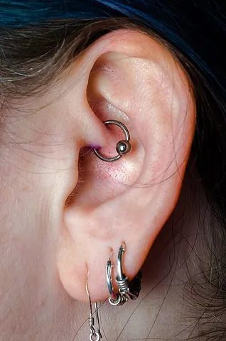 daith: an ear piercing in the inner cartilage just above the earhole