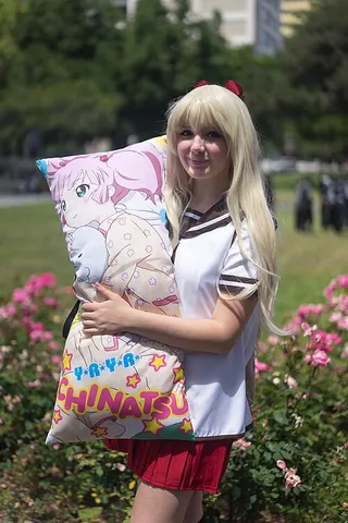 dakimakura: a body-length pillow, originating in Japan, which can be embraced or wrapped around one's body...