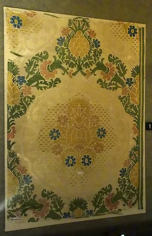 damask: an ornate silk fabric originating from Damascus