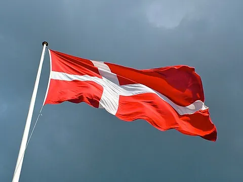 dannebrog: the national flag of Denmark, featuring a white Nordic cross atop a red background; is said to be...