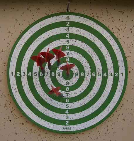 dartboard: a board used as a target for throwing darts