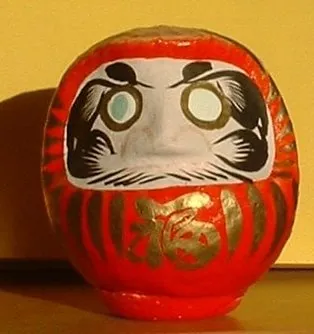 daruma: a hollow, round, Japanese traditional doll modeled after Bodhidharma, the founder of the Zen sect...