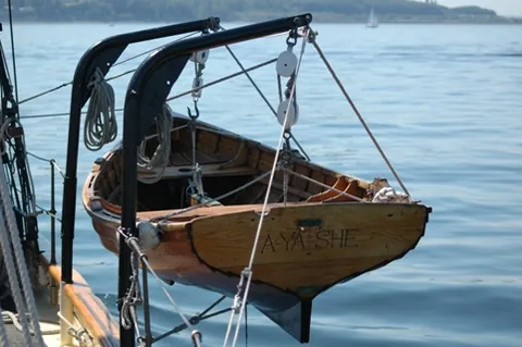 davit: a spar formerly used on board of ships, as a crane to hoist the flukes of the anchor to the top of...