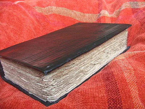 deckle edge: the rough, untrimmed edge of paper left by a deckle