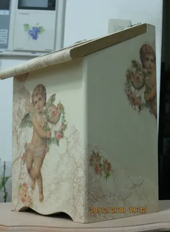 decoupage: an art technique in which paper cutouts (either from magazines etc or specially made) are glued...