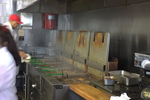 deep-fat fryer: a heated vessel for frying food by immersing in hot fat or oil, as opposed to shallow frying in a...