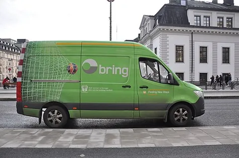 delivery van: an enclosed commercial vehicle used for deliveries to businesses and homes