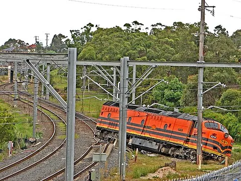 derailment: the action of a locomotive or train leaving the rails along which it runs