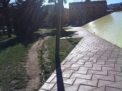 desire line: a path that pedestrians or vehicles take informally rather than taking a sidewalk or set route, for...