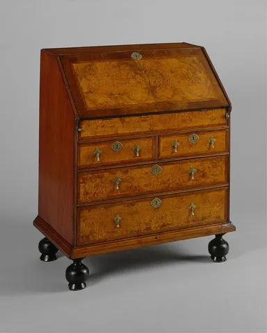 desk: a table, frame, or case, in past centuries usually with a sloping top but now usually with a flat...