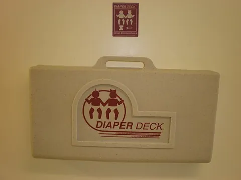 diaper deck: a changing table, especially one that is foldable, wall-mounted and intended for infants or small...