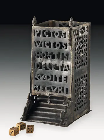 dice tower: a structure, containing deflecting objects called bafflers and having a tray at the bottom, into...