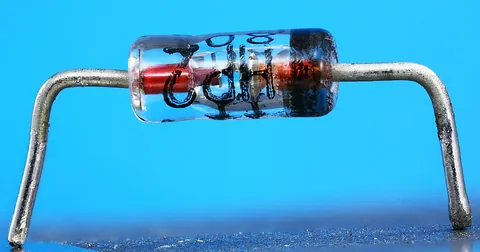 diode: an electronic device that allows current to flow in one direction only; used chiefly as a rectifier