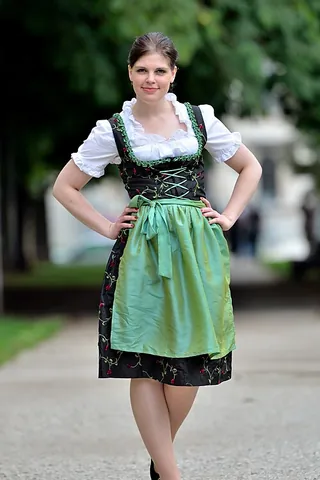 dirndl: a traditional Alpine woman's dress having a tight bodice and full skirt