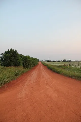 dirt road: an unpaved road consisting solely of subgrade material