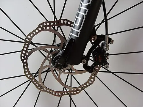 disc brake: a type of brake where the friction is produced by brake pads which are pressed against a disc (or...