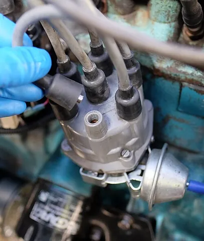 distributor cap: part of an internal combustion engine that covers the distributor and rotor, and helps distribute...