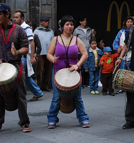 djembe: a large, rope-tuned, skin-covered drum played with the bare hands, used in West African and some...