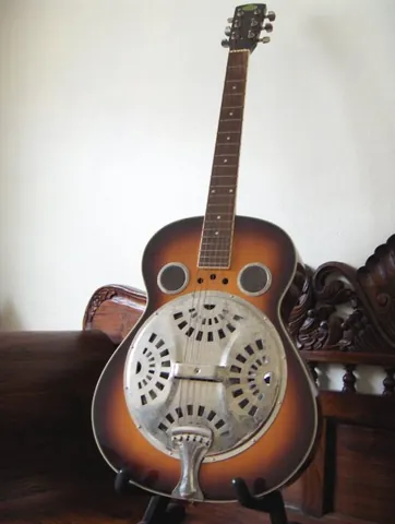 dobro: an acoustic guitar with a metal resonator