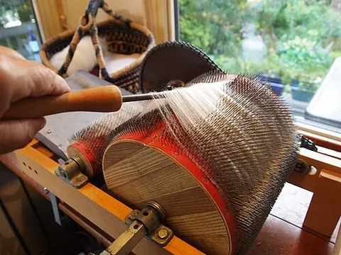 doffer: in a carding machine, a device such as a revolving cylinder or a vibrating bar with teeth, that...