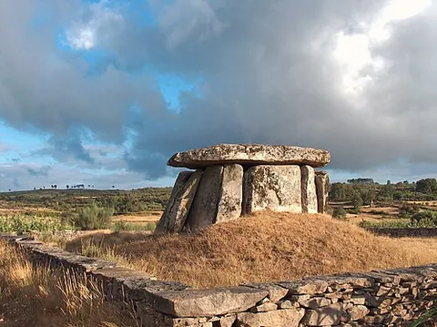 dolmen: a prehistoric megalithic tomb consisting of a capstone supported by two or more upright stones,...
