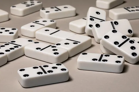 domino: a tile divided into two squares, each having 0 to 6 (or sometimes more) dots or pips (as in dice),...