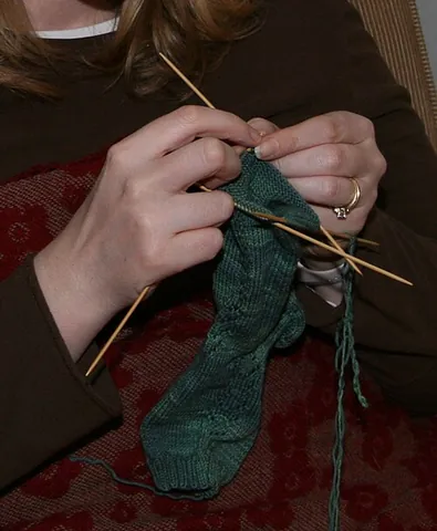 double-pointed needle: a knitting needle with points at both ends; used in sets of four or five to knit narrower tubes...