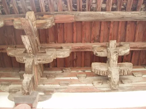 dougong: a structural element consisting of interlocking wooden brackets as used in traditional Chinese...