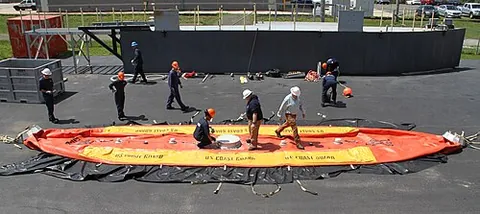dracone: a large bag towed by a powered vessel to transport a fluid cargo, such as a petroleum product...