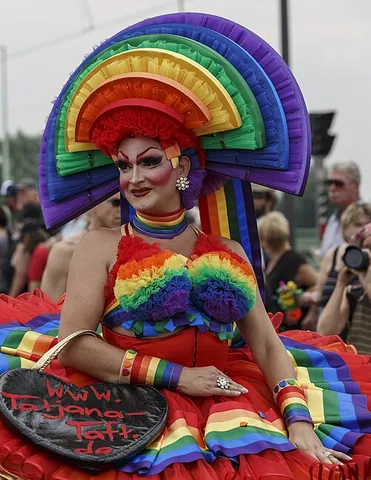 drag queen: a person, usually male, who dresses up in women's clothing and makeup, typically in an exaggerated...