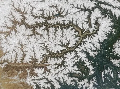 drainage system: pattern formed by the streams, rivers, and lakes in a particular drainage basin