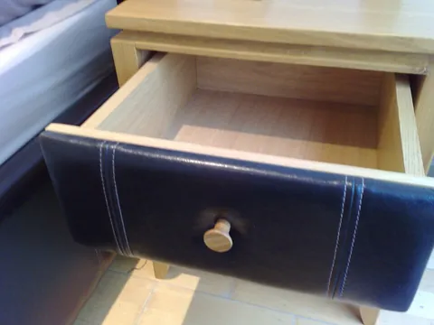 drawer: an open-topped box that can be slid in and out of the cabinet that contains it, used for storing...