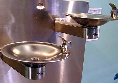 drinking fountain: a device in a public place that provides water to drink