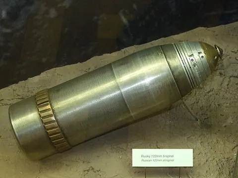 driving band: a band of soft metal near the base of an artillery shell which is forced into engagement with the...